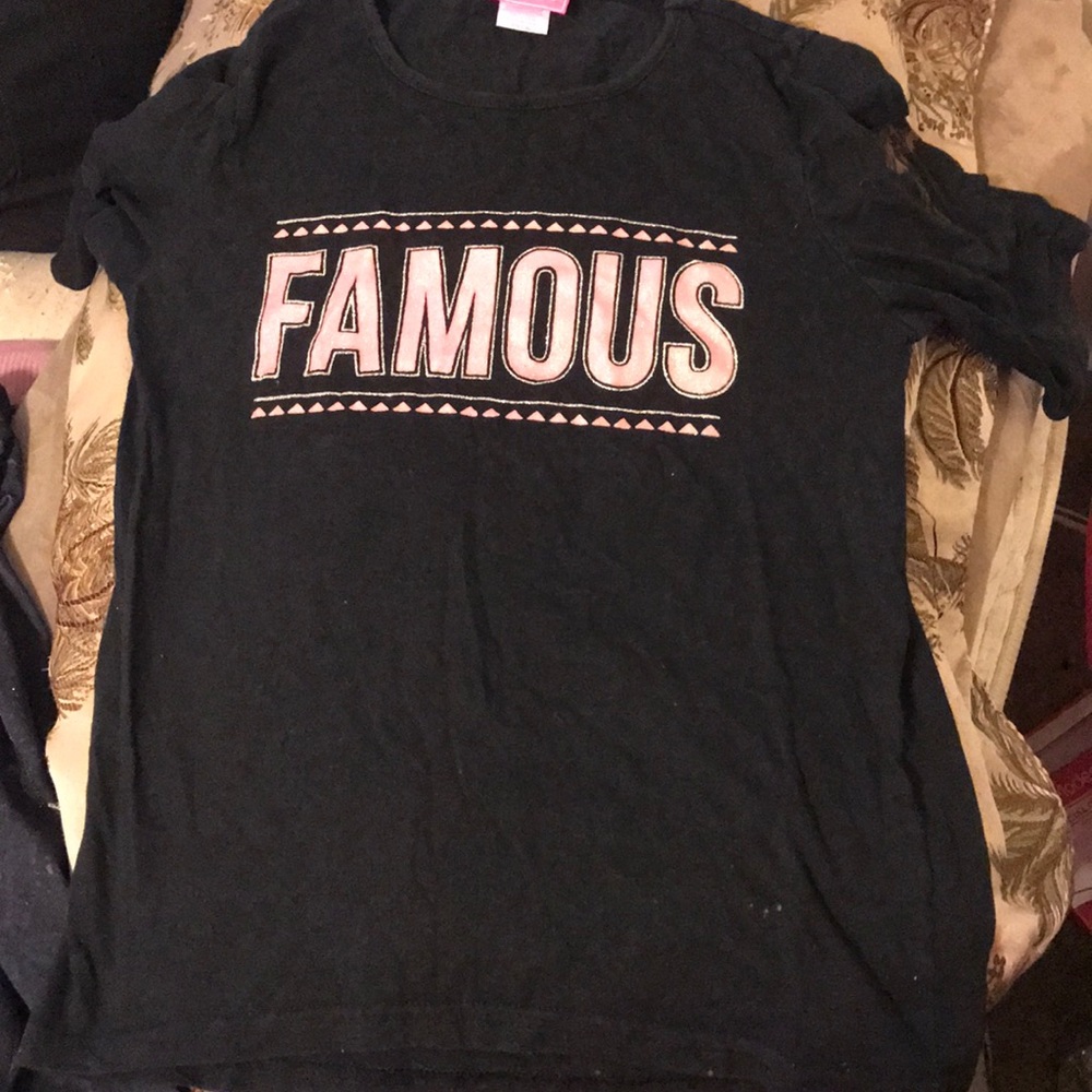 Black Shirt With Word Famous.